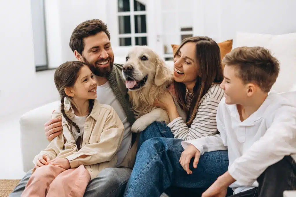 family,enjoying,quality,time,together,,embracing,and,laughing,with,their